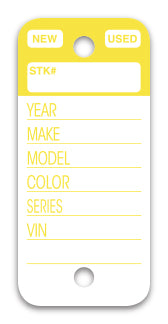 A white key tag with a yellow colored bar on the top. To go on a keyring at a car dealership. www.flywheelnw.com